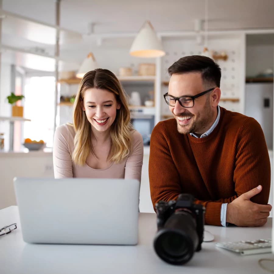 Design professionals reviewing a Squarespace website on a laptop